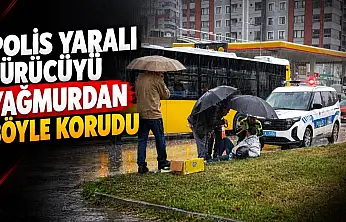 Polis Yaralı Sürücüyü Yağmurdan Böyle Korudu!