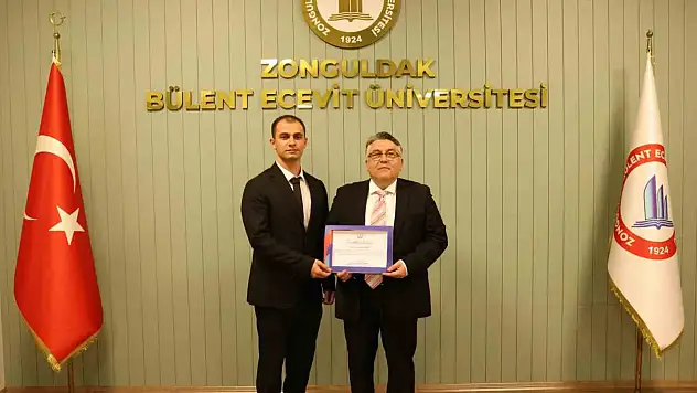 Rektör Özölçer'den , Yusuf Nas'a Tebrik