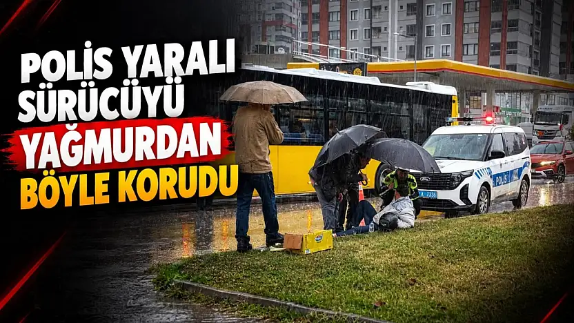 Polis Yaralı Sürücüyü Yağmurdan Böyle Korudu!